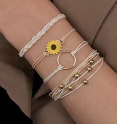 These Pura Vida/string/ sunflower charming bracelets are very cute for summer. They are strong symbol of happiness and connection, warmness and brightness. Let this wish bracelet or anklet bring shine, warmth, love and happiness into your and your beloved ones.    Put this lovely wish bracelet on, make a wish and get good luck! Keep it on and when it falls off, it's believed that your wish will come true! Buy them for your mom, dad, siblings, relatives, girlfriend, boyfriend, school mate, classmate, co-workers, or staff for a cute little gift for the holiday to make their day. They will love this little surprise when they see the special message card  you sent. How lovable is that! *Made with high quality 1 mm polyester string, have brass sunflower, crystal beads and plastic cowries *They Bracelets String, Jewelry Sets Handmade, Vacation Accessories, Bracelet Kits, Styl Boho, Wish Bracelets, Woven Bracelets, String Bracelet, Anklet Bracelet