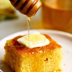 a piece of cake is being drizzled with honey on the top and bottom