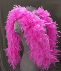 a mannequin with pink feathers on it