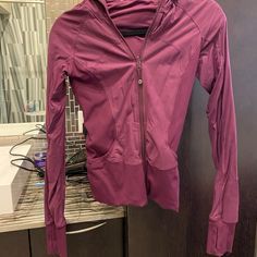 Authentic Lululemon Burgundy Zip-Up Jacket With Hood. Only Worn Twice In Perfect Condition And Looks Brand New. They No Longer Make This Jacket! Rainproof Material & Reversible. Size 4, Fits Xs/S/M Purple Jacket, Jacket With Hood, Utility Jacket, Red Purple, Light Red, Zip Up, Color Purple, Hooded Jacket, Lululemon Athletica