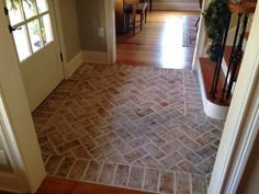 an entry way leading into a house with wood floors