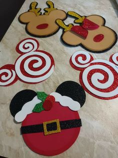 mickey mouse and minnie mouse christmas decorations on a table