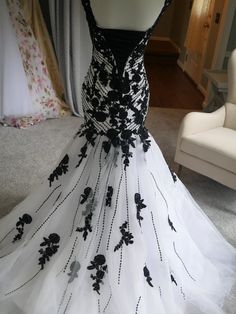 a black and white dress with flowers on it