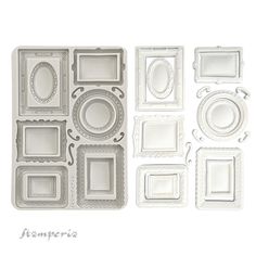 some white frames and plates on a white background