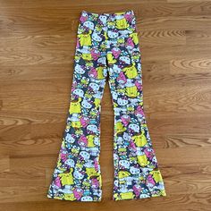 Brand New! Hello Kitty And Friends Graphic Flare Leg Pants. Pull On. Elastic Waist. Flare Leg. White, Yellow, Gray, Pink & Blue. Full Length. Regular Fit. Slight Stretch. 95% Cottonr/5% Spandex. The Inseam Is Roughly About 31" & The Rise Is About 11." The Leg Opening At The Bottom Is About 11.75." Size Small. Hello Kitty Pants, Friends Graphic, Hello Kitty And Friends, Flare Leg Pants, Gray Yellow, The Rise, Flare Pants, Leg Pants, Pink Blue