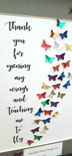 a sign that says thank you for opening my wings and teaching me to fly with lots of butterflies