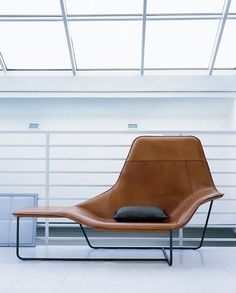 a chair sitting in front of a garage door