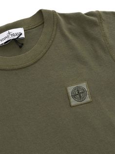 Military green T-shirt for children with tone-on-tone Stone Island logo in cotton.Composition: 100% COTTON Green Cotton Tops With Logo Detail, Green Cotton T-shirt With Logo, Casual Green Logo T-shirt, Green Casual Logo T-shirt, Green Casual T-shirt With Logo, Stone Island Logo, Island Logo, Stone Island Junior, Green T Shirt