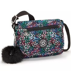 Features Durable, Flexible Nylon Comprises A Kipling Mini Crossbody Designed To Hang At The Hip For On-The-Go Access Without Added Bulk. Mini Sized Bag; 7-3/4"W X 6"H X 3-1/4"D (Width Is Measured Across Bottom Of The Handbag) Silhouette Is Based Off 5'9" Model 13" To 25-1/2"L Adjustable Crossbody Strap Button Flap Closure Silver-Tone Exterior Hardware, 1 Front Zip Pocket & Monkey Fob 1 Interior Zip Pocket & Key Clasp Polyamide/Polyester Spot Clean Imported Multicolor Nylon Crossbody Shoulder Bag, Casual Multicolor Nylon Shoulder Bag, Trendy Multicolor Nylon Shoulder Bag, Out Of Place, Colour Star, Mini Handbags, Mini Crossbody Bag, Star Flower, Small Wallet