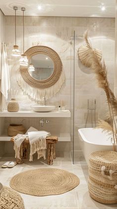 the bathroom is decorated in neutral tones and features natural materials such as rugs, baskets, towels, and bathtub