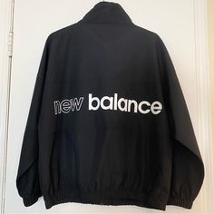 New Balance Black Zip Up Athletic Windbreaker Jacket Size Small Water Resistant Oversized Fit 2 Front Zippered Pockets 100% Polyester New With Tags New Balance Long Sleeve Outerwear For Streetwear, New Balance Sporty Fall Outerwear, Sporty New Balance Outerwear For Fall, Sporty Winter Outerwear By New Balance, New Balance Winter Outdoor Outerwear, New Balance Long Sleeve Outerwear For Fall, Grey Puffer Jacket, Green Windbreaker, Faux Suede Moto Jacket