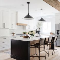 Mixed finishes create a soft, airy feel in this Modern Farmhouse kitchen by @whitehousedesigns.ca featuring a pair of Capri Wide Pendants by @generationlighting Thomas O'Brien.⁣ Photo: @natkay.ca #interiordesign #pendant #lighting #kitchenlighting #homedecor #interiordesign #design #kitchenseating #whitekitchen Modern Farmhouse Kitchen, Modern Farmhouse Kitchens, Wood Kitchen, Kitchen Style, Home Decor Kitchen