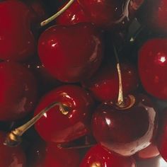 a close up view of some red cherries