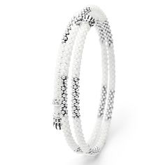 Ten sterling silver stations highlighted by white ceramic Caviar beading finished with fluted sterling silver endcaps form this coil bracelet. Elegant White Beaded Bracelets With Silver Beads, White Sterling Silver Stackable Bracelets, White Sterling Silver Jewelry With Spacer Beads, White Sterling Silver Bracelets With Spacer Beads, Sterling Silver Bracelets With White Spacer Beads, Stackable White Sterling Silver Beaded Bracelets, Adjustable Sterling Silver Bracelet With Silver Beads, Adjustable White Sterling Silver Bracelet With Silver Beads, White Bracelets With Sterling Silver Clasp And Round Beads