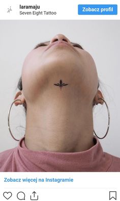 a woman with a small tattoo on her neck