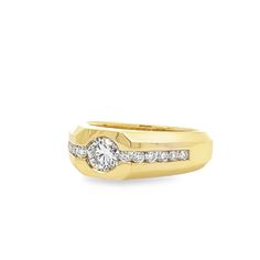 a yellow gold ring with diamonds on the side and a diamond set in the middle