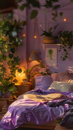 an unmade bed with purple comforter and plants on the wall in front of it