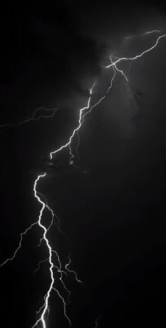 a black and white photo of lightning in the sky