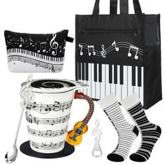 music themed items are displayed in front of a black and white bag with musical notes on it