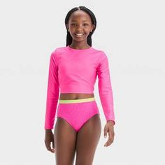 Long Sleeve Rash Guard With Uv Protection For Playwear, Stretch Tankini For Beach Playwear, Playful Stretch Swimwear With Upf 50+, Long Sleeve Swimwear With Upf 50+ For Play, Spring Rash Guard With Uv Protection For Surfing, Spring Beachwear Rash Guard For Pool, Playful Tankini With Uv Protection For Swimming, Playful Swimwear For Water Sports With Uv Protection, Spring Stretch Rash Guard For Pool