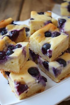 several pieces of blueberry cheesecake on a white plate