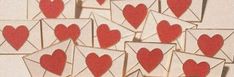 many envelopes with hearts cut out of them