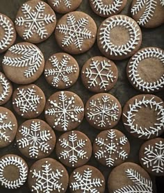 some cookies are decorated with white snowflakes