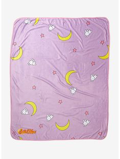 a purple blanket with stars and crescents on it