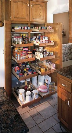 an organized pantry in the middle of a kitchen