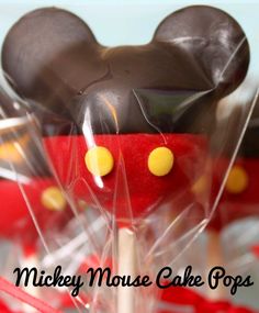 a close up of a chocolate cake in a plastic bag on a table with candy