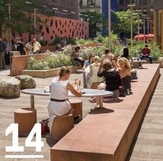 people are sitting at tables in the city