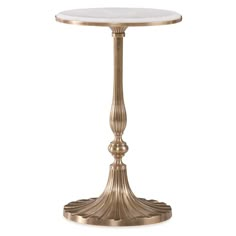 a gold pedestal table with marble top and metal base on an isolated white background photo