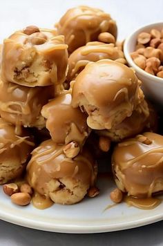 a white plate topped with peanut butter pretzels covered in caramel