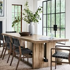 a dining room table with chairs around it