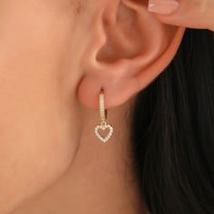 Heart Earring Solid Gold * Love Earring * Lovers Earring *  18K 14K 10K, CZ, Swarovski Gemstones * Jewelry gift for People in Love This solid 10K/14K/18K gold huggie earring features a gorgeous heart-shaped design that dangles beautifully. The high-quality Swarovski cubic zirconia gemstones add a stunning shine and sparkle to the already beautiful earring. The heart shape is intricately crafted with attention to detail, making it a charming addition to any jewelry collection. The huggie style of the earring ensures a comfortable and secure fit, while the dangling heart shape adds a touch of playful elegance. Perfect for any occasion, this earring is sure to make a statement and be a cherished piece for years to come. * 100% 10K 14k 18K Solid Yellow Gold (Not Gold Vermail or Not Gold Plated Luxury Yellow Gold Heart-shaped Diamond Earrings, Affordable Gold Heart Earrings For Mother's Day, Valentine's Day Huggie Heart Earrings For Anniversary, Valentine's Day Huggie Heart Earrings, Valentine's Day Heart-shaped Fine Hoop Earrings, Valentine's Day Heart Shaped Fine Hoop Earrings, Dainty Hoop Earrings For Valentine's Anniversary, Heart Charm Huggie Earrings For Wedding, Wedding Heart Charm Huggie Earrings