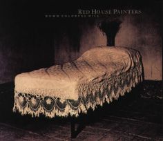 an old fashioned bed in a dark room