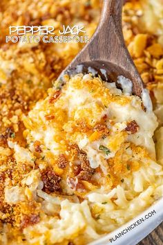 a casserole dish with cheese and other toppings in a white bowl on a wooden spoon