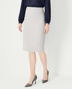 Elevate your office wardrobe with the Ann Taylor Petite High Waist Seamed Pencil Skirt in Pebble Grey Melange. This skirt is a testament to sophisticated style and comfort, designed specifically for petite frames.

- Size: Petite 00
- Color: Pebble Grey Melange
- Material: 66% Polyester, 28% Rayon, 6% Spandex; Lining: 100% Polyester
- Length: 23 1/2 inches long
- Fit: Tailored fit
- Features: High waist, seamed detailing, hidden back zipper with hook-and-eye closure, fully lined
- Care: Machine Sweater Dress Petite, Petite Midi Skirt, Petite Womens Clothing, Morning Meetings, Stylish Petite, Wrap Sweater Dress, Ruffle Trim Top, Office Wardrobe, Midi Flare Skirt