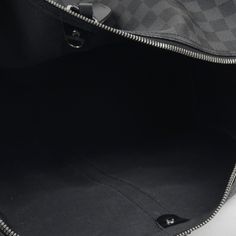 Louis Vuitton presents their signature Keepall bag, the perfect travel accessory for both men and women. Carefully crafted in the brand's iconic Damier Graphite canvas with the shoulder strap, the Keepall is sleek and sophisticated. Large and spacious, making it easy to carry your whole world with you wherever you go, the Keepall is also extremely lightweight. It's the perfect travel companion and is a necessary addition to any luxury bag collection, especially luggage. SPL Exterior Damier Graph Luxury Travel Shoulder Bag With Embossed Logo, Luxury Black Travel Bag With Detachable Strap, Luxury Black Canvas Travel Bag, Luxury Black Men's Weekender Bag, Keepall 55 Bandouliere, Louis Vuitton Presents, Louis Vuitton Keepall Black, Keepall 50 Louis Vuitton, Louis Vuitton Keepall 45