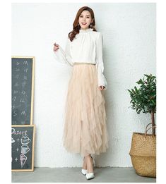 Brand Name: NuktyMaterial: MeshStyle: High StreetElasticity: Slight StrechOrigin: Mainland ChinaCN: GuangdongFabric Type: MeshWaistline: empirePattern Type: SolidFit Type: Regulai FitSilhouette: PleatedDresses Length: Mid-CalfAge: 18-24Decoration: NONEGender: WOMEN[23y 3m 8d] Beige Party Skirt For Spring, Chic Stretch Tulle Maxi Skirt, Spring Party Beige Skirt, Spring Party Beige Maxi Skirt, Beige Ruffled Skirt For Parties, Fall Party Skirt In Feminine Style, Beige Ruffle Skirt For Fall, Feminine Beige Skirt For Fall, Beige Stretch Skirt For Fall