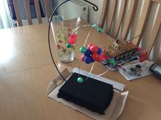 a table topped with a vase filled with flowers