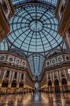 the inside of a large building with glass ceiling