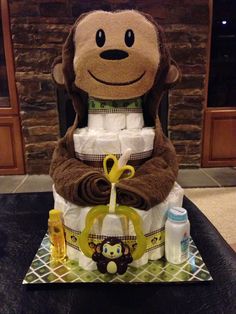 a diaper cake made to look like a monkey