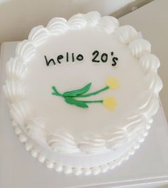 a white cake with yellow flowers and the words hello 209's written on it