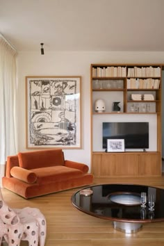 a living room filled with furniture and bookshelves