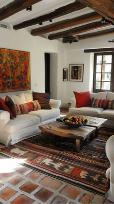 a living room filled with furniture and a painting on the wall