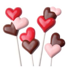 three heart shaped lollipops on top of each other