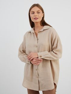 "PINE is an oversized drop shoulder linen shirt. DETAILS - Loose fit - Long sleeves - Small coconut buttons closure, also available with large coconut buttons - 100% lightweight European linen fabric - Cut and sewn to order just for you in our studio COLOR - Beige, you can also choose other colors above - Fabric samples are available here https://www.etsy.com/listing/586569696/linen-fabric-samples SIZING & FIT - Relaxed, loose fit - Size down for less oversized look - Model is 5'10\" / 178cm and wearing a size S CARE FOR LINEN - Machine wash up to 30ºC/86ºF gentle cycle - Lay flat to dry or tumble dry low - Warm iron if needed - Do not bleach SIZE GUIDE Size conversion guide Size XS (US 0-2, IT 36-38, UK 4-6, Japan 3-5, France 32-34) Size S (US 4-6, IT 40-42, UK 8-10, Japan 7-9, France 36- Oversized Linen Blouse With Button Closure, Oversized Linen Button-up Blouse, Classic Oversized Linen Blouse, Oversized Linen Collared Blouse, Oversized Linen Collared Shirt, Oversized Button-up Neutral Top, Classic Oversized Linen Tops, Oversized Linen Shirt With Button Closure, Oversized Neutral Button-up Top