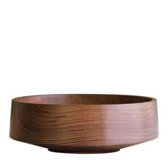 a wooden bowl sitting on top of a table