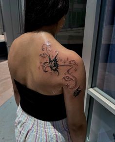 a woman with a tattoo on her back